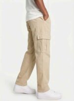 Redefine your everyday carry and comfort with the BREXX Urban Utility Beige Cargo Pants. Designed for the man who values both function and fashion, these trousers are the ultimate addition to a versatile wardrobe. Whether you are navigating the urban jungle or heading out for a casual weekend, the structured design ensures you look sharp without compromising on comfort. Key Features & Benefits: Premium Cotton Twill: Crafted from high-grade, breathable cotton fabric that offers superior durability and a soft hand-feel. Multi-Functional Storage: Equipped with deep side cargo pockets with secure flap closures, perfect for phones, wallets, and keys, plus standard front and back pockets. Modern Tapered Fit: expertly tailored to provide a relaxed feel at the thighs while tapering neatly at the ankles for a clean, contemporary silhouette. Reinforced Construction: Features heavy-duty stitching on belt loops and stress points to ensure longevity. Versatile Styling: The neutral beige tone pairs effortlessly with t-shirts, hoodies, or button-downs for year-round wear. Upgrade your rotation with the pants that work as hard as you do. Experience the perfect blend of tactical utility and street-ready style with BREXX