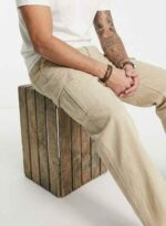 Redefine your everyday carry and comfort with the BREXX Urban Utility Beige Cargo Pants. Designed for the man who values both function and fashion, these trousers are the ultimate addition to a versatile wardrobe. Whether you are navigating the urban jungle or heading out for a casual weekend, the structured design ensures you look sharp without compromising on comfort. Key Features & Benefits: Premium Cotton Twill: Crafted from high-grade, breathable cotton fabric that offers superior durability and a soft hand-feel. Multi-Functional Storage: Equipped with deep side cargo pockets with secure flap closures, perfect for phones, wallets, and keys, plus standard front and back pockets. Modern Tapered Fit: expertly tailored to provide a relaxed feel at the thighs while tapering neatly at the ankles for a clean, contemporary silhouette. Reinforced Construction: Features heavy-duty stitching on belt loops and stress points to ensure longevity. Versatile Styling: The neutral beige tone pairs effortlessly with t-shirts, hoodies, or button-downs for year-round wear. Upgrade your rotation with the pants that work as hard as you do. Experience the perfect blend of tactical utility and street-ready style with BREXX